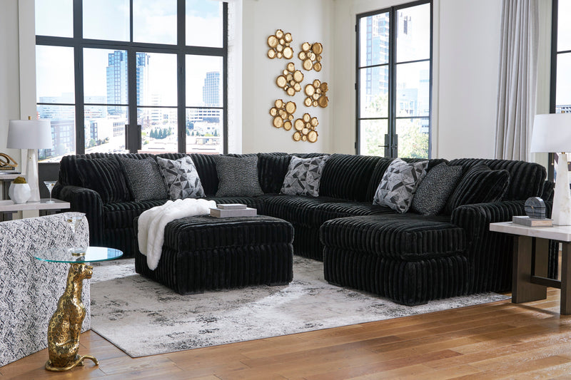 Midnight-Madness 4-Piece Sectional with Ottoman in Onyx from Ashley - DMV Furniture