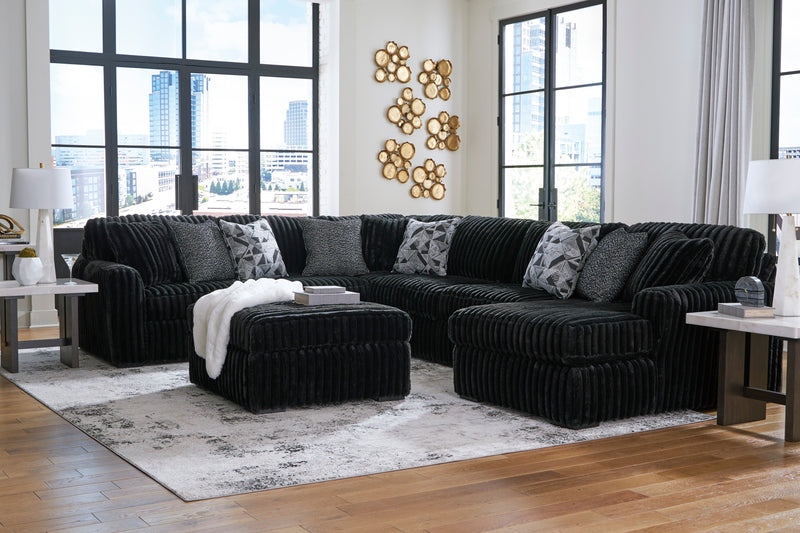 Midnight-Madness 4-Piece Sectional with Ottoman in Onyx from Ashley - DMV Furniture