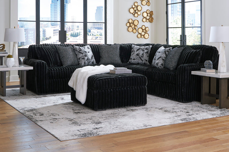 Midnight-Madness 3-Piece Sectional with Ottoman in Onyx from Ashley - DMV Furniture