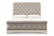 Realyn Chipped White California King Sleigh Bed from Ashley - DMV Furniture