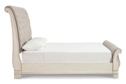 Realyn Chipped White California King Sleigh Bed from Ashley - DMV Furniture