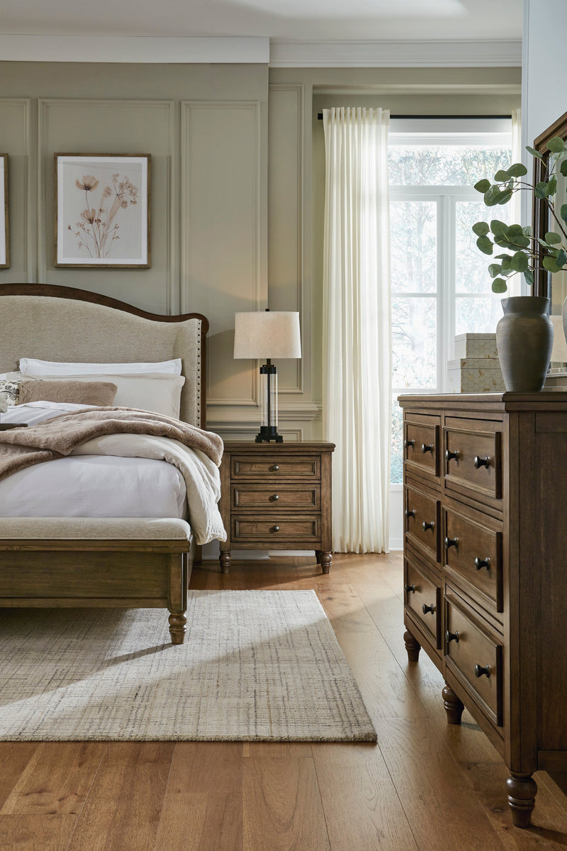 Sturlayne Brown California King Upholstered Panel Bed from Ashley - DMV Furniture