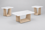 A modern coffee table and two matching end tables in a studio setting. The tables feature white marble tops with subtle gray veining and angled light oak wood bases with an open lower shelf, set against a neutral gray background.