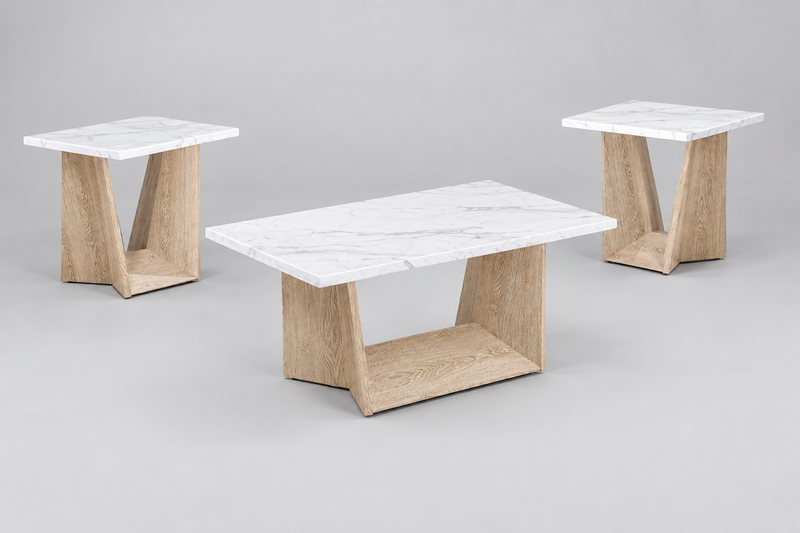 A modern coffee table and two matching end tables in a studio setting. The tables feature white marble tops with subtle gray veining and angled light oak wood bases with an open lower shelf, set against a neutral gray background.