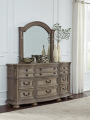 Ardenfield Queen Upholstered Sleigh Bed with Mirrored Dresser and Nightstand in Light Brown from Ashley - DMV Furniture