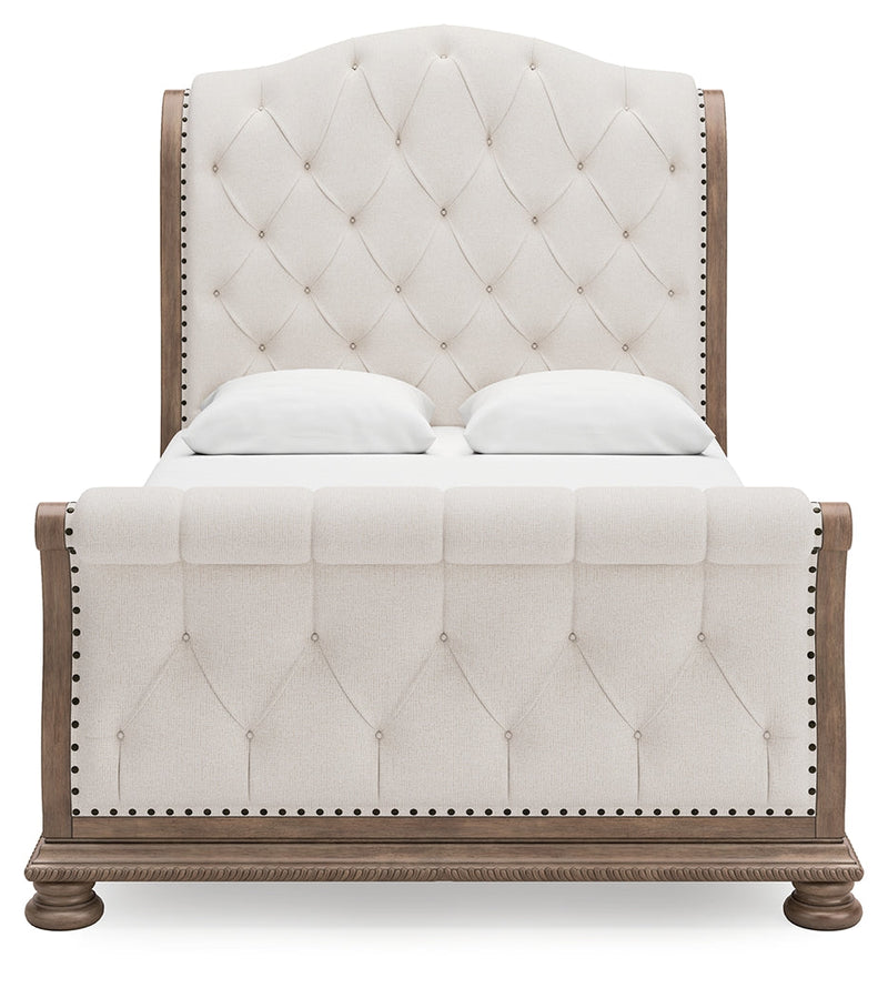 Ardenfield Queen Upholstered Sleigh Bed with Mirrored Dresser in Light Brown from Ashley - DMV Furniture