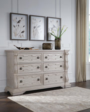 Bruchandi California King Upholstered Panel Bed with Dresser and Chest in Antique White - PKG023754