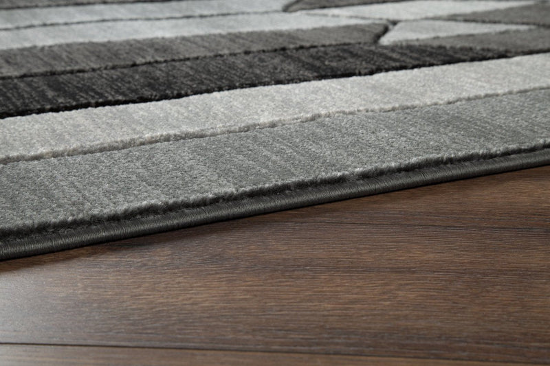 Chayse Black/Gray 6'6" x 9'6" Rug - DMV FurnitureRugs