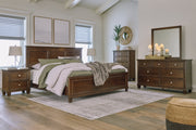 Danabrin California King Panel Bed with Mirrored Dresser and Nightstand in Brown - PKG015190