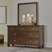 Danabrin King Panel Storage Bed, Dresser and Mirror in Brown - PKG023943