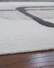Davismour Ivory/Taupe/Charcoal 5' x 7' Area Rug - R407562
