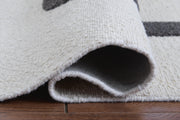 Davismour Ivory/Taupe/Charcoal 5' x 7' Area Rug - R407562