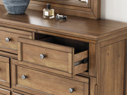 Feddinger California King Storage Sleigh Bed with Mirrored Dresser in Medium Brown - PKG022340