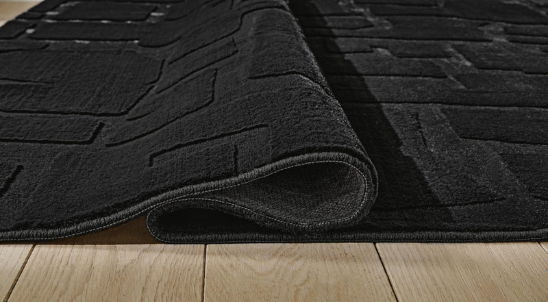 Gibbswell Black Washable 5' x 7' Area Rug - R407462