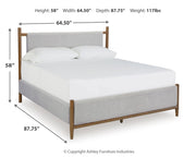 Lyncott Queen Upholstered Bed with Mirrored Dresser and Chest in Brown from Ashley - DMV Furniture