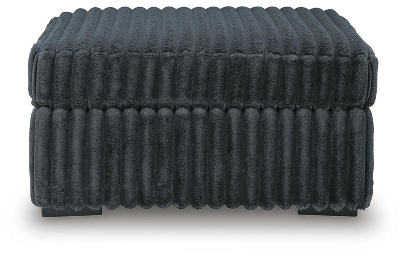Midnight-Madness 4-Piece Sectional and Ottoman - 98105U5