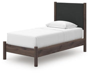 Pamytta Twin Upholstered Panel Platform Bed, Dresser and Chest in Brown - PKG022759