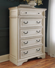 Realyn Chipped White King Panel Upholstered Bed, Dresser, Mirror and Chest - B743B68