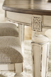 Realyn Chipped White Dining Table and 8 Ribbon Back Chairs from Ashley - DMV Furniture