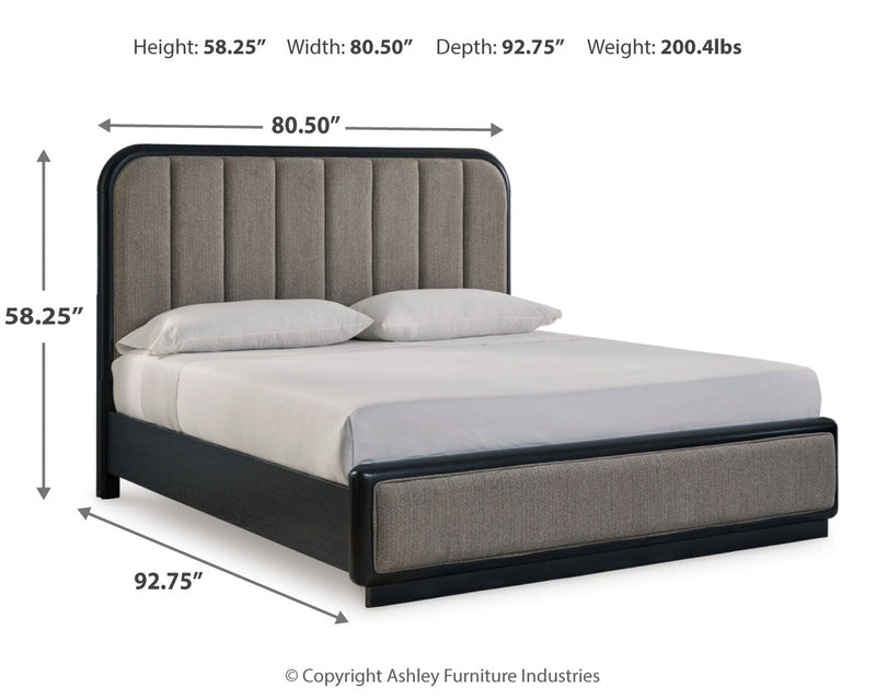 Rowanbeck California King Upholstered Panel Bed with Mirrored Dresser and Nightstand in Gray/Black from Ashley - DMV Furniture