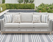 Seton Creek Outdoor Sofa and Loveseat with Coffee Table in Gray from Ashley - DMV Furniture