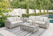 Seton Creek Outdoor Sofa and Loveseat with Coffee Table in Gray from Ashley - DMV Furniture