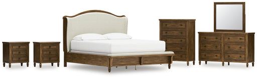 Sturlayne California King Upholstered Panel Bed with Mirrored Dresser, Chest and 2 Nightstands in Brown from Ashley - DMV Furniture