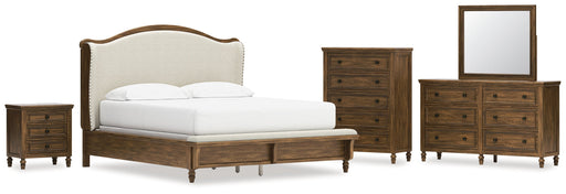 Sturlayne California King Upholstered Panel Bed with Mirrored Dresser, Chest and Nightstand in Brown from Ashley - DMV Furniture