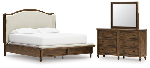 Sturlayne California King Upholstered Panel Bed with Mirrored Dresser in Brown from Ashley - DMV Furniture