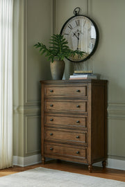 Sturlayne King Upholstered Panel Bed with Mirrored Dresser and Chest in Brown from Ashley - DMV Furniture