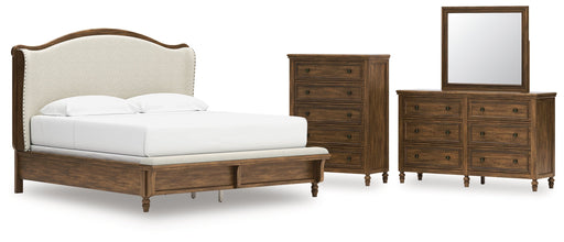 Sturlayne King Upholstered Panel Bed with Mirrored Dresser and Chest in Brown from Ashley - DMV Furniture