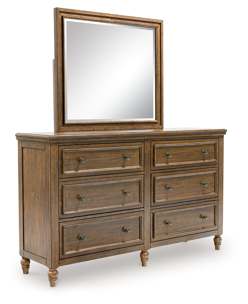 Sturlayne King Upholstered Panel Bed with Mirrored Dresser, Chest and Nightstand in Brown from Ashley - DMV Furniture