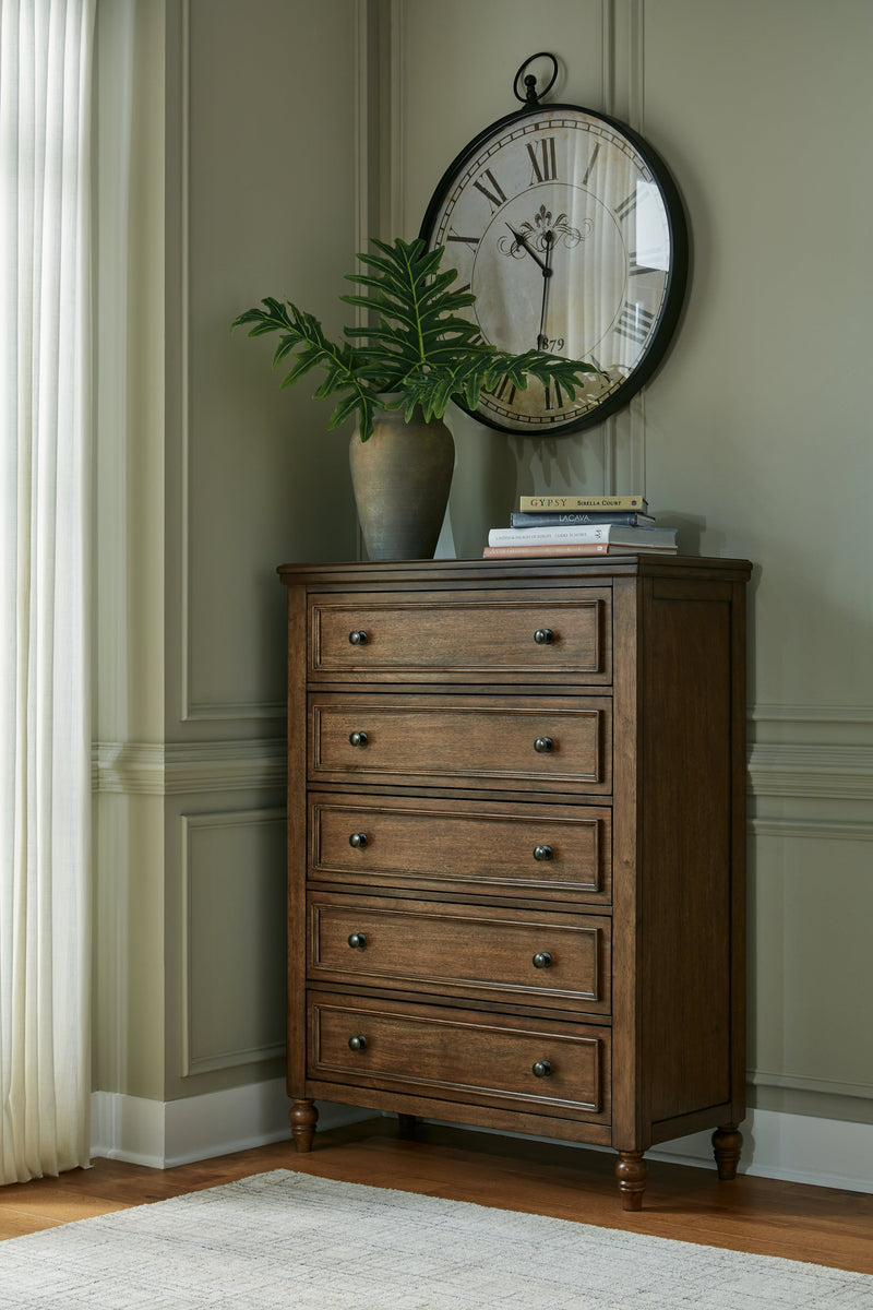 Sturlayne King Upholstered Panel Bed with Mirrored Dresser, Chest and Nightstand in Brown from Ashley - DMV Furniture