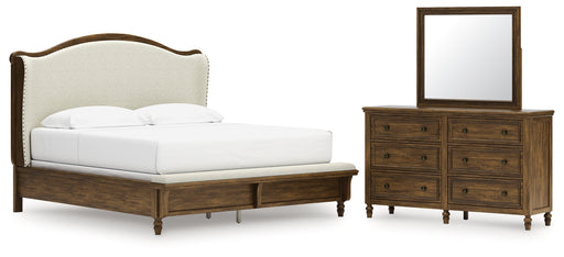 Sturlayne King Upholstered Panel Bed with Mirrored Dresser in Brown from Ashley - DMV Furniture