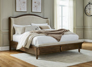 Sturlayne Queen Upholstered Panel Bed with Mirrored Dresser and Nightstand in Brown from Ashley - DMV Furniture