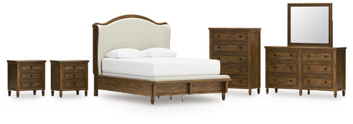 Sturlayne Queen Upholstered Panel Bed with Mirrored Dresser, Chest and 2 Nightstands in Brown from Ashley - DMV Furniture