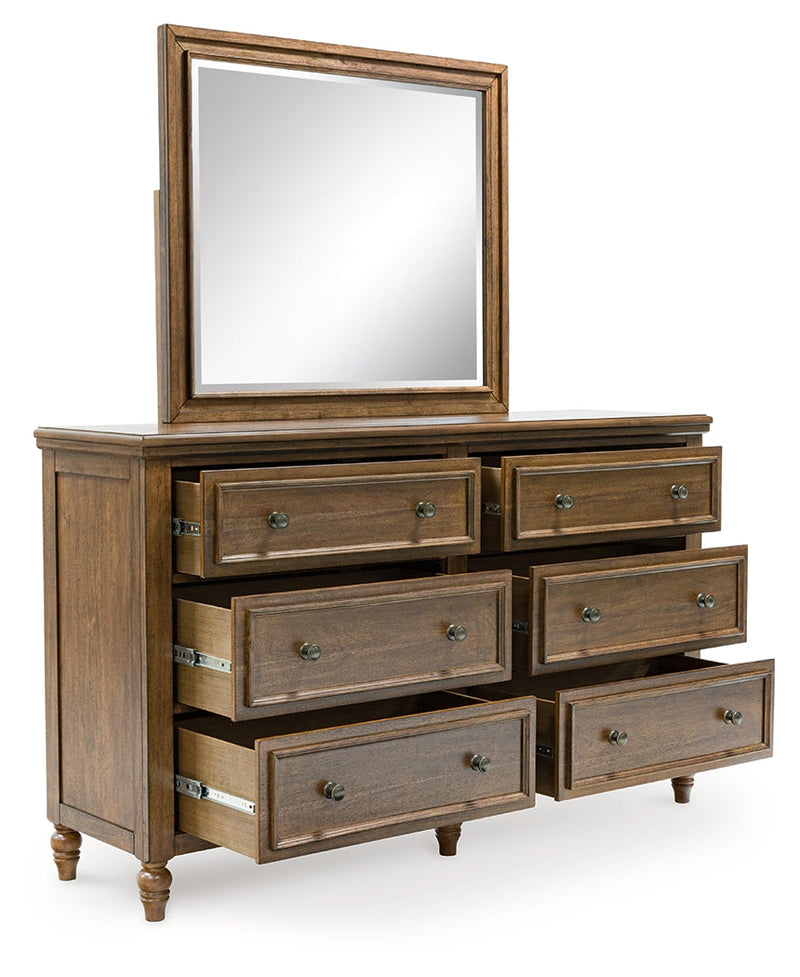 Sturlayne Queen Upholstered Panel Bed with Mirrored Dresser, Chest and 2 Nightstands in Brown from Ashley - DMV Furniture