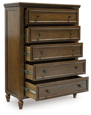 Sturlayne Queen Upholstered Panel Bed with Mirrored Dresser, Chest and 2 Nightstands in Brown from Ashley - DMV Furniture