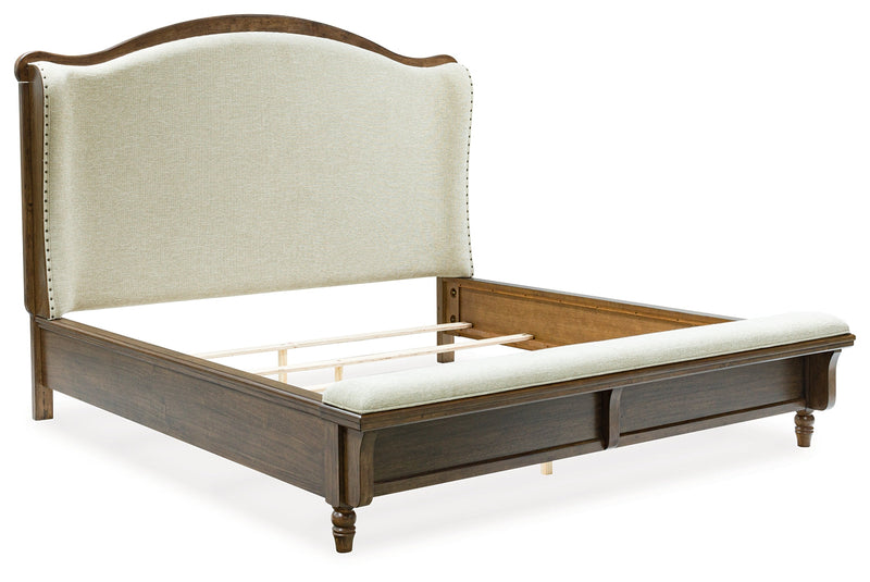 Sturlayne Queen Upholstered Panel Bed with Mirrored Dresser, Chest and Nightstand in Brown from Ashley - DMV Furniture