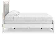 Zuraleus King Upholstered Panel Bed, Dresser, Mirror and Chest in White - PKG022835